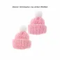 Preview: Zwei rosa Miniatur-Strickmützen mit weißen Bommeln in der Größe von ca. 3,5 x 4 cm